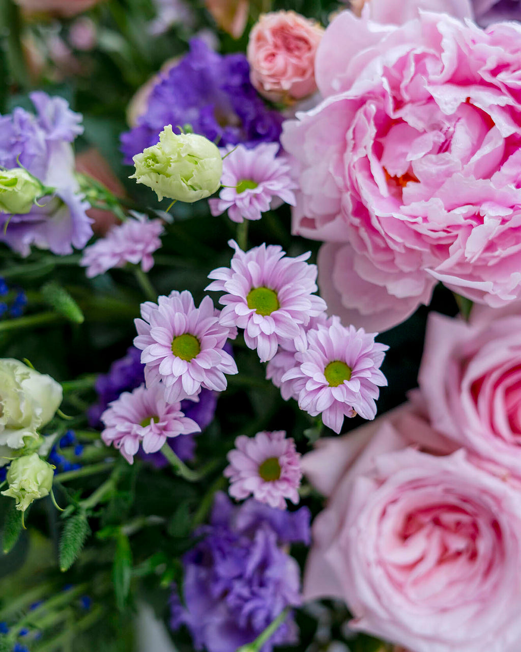 variety of flowers beautifully arranged in a large box