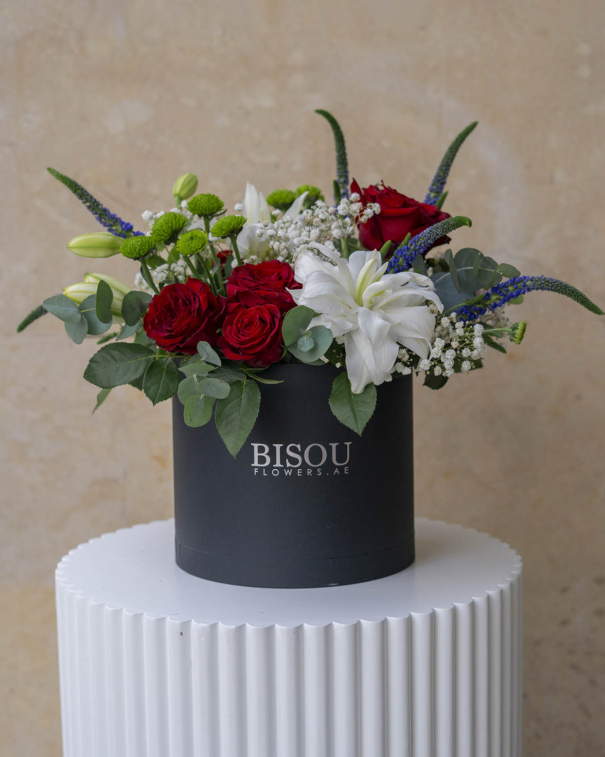 bella flower bouquet arrangement in a drum box