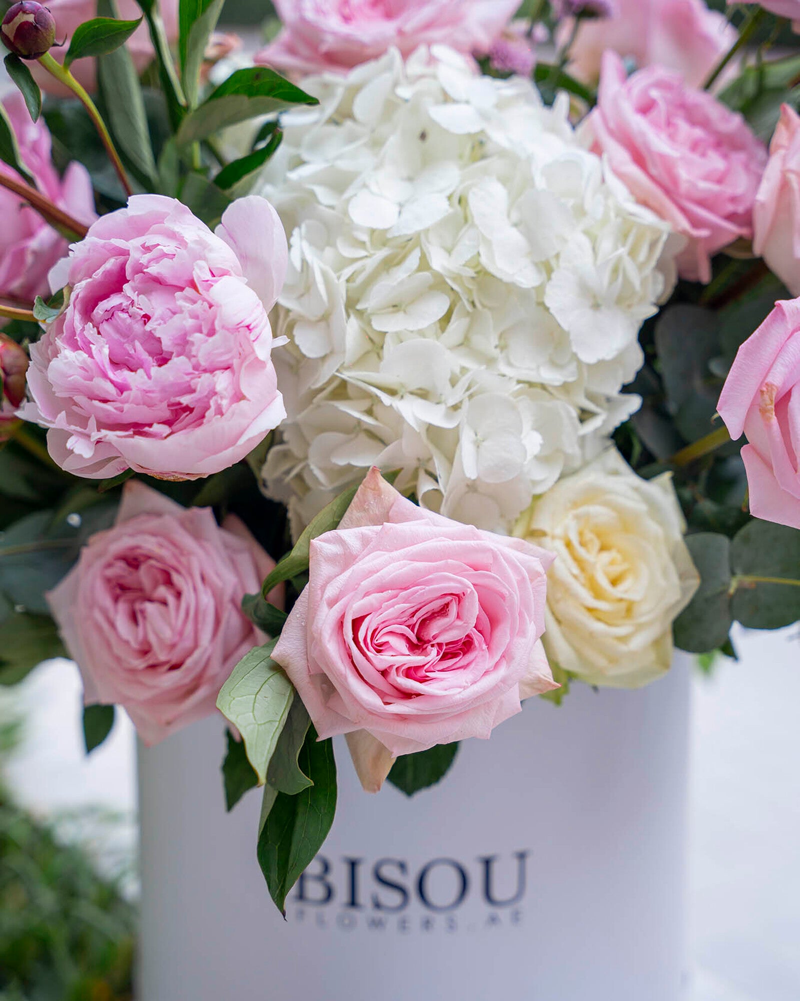 Platinum bouquet containing various pink flowers