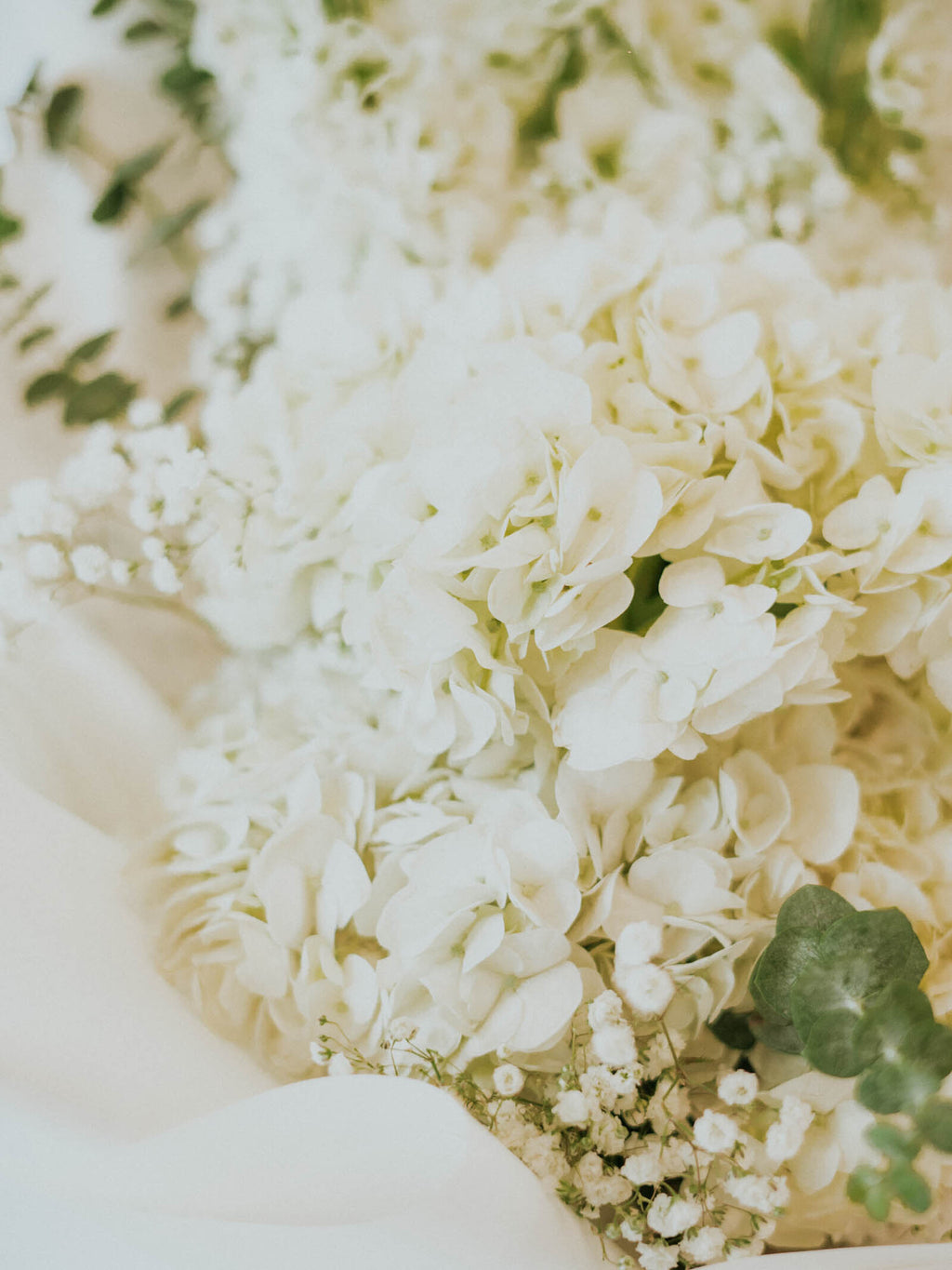 delphinium, hydrangea and eucalyptus hand-tied flower arrangement