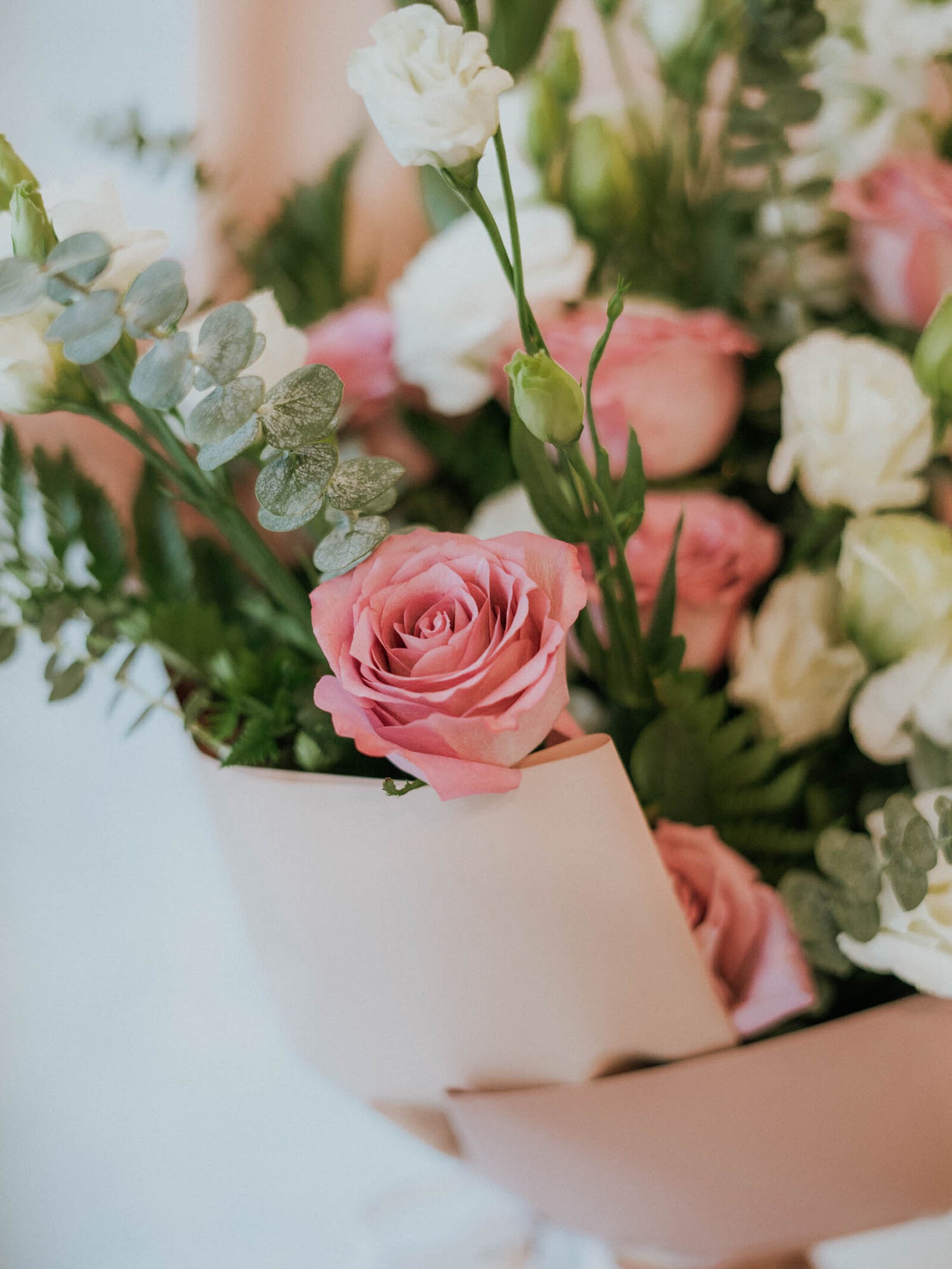 Bouquet of 14 stems of purple roses and white lisisanthes and 2 stems of white Delphinium