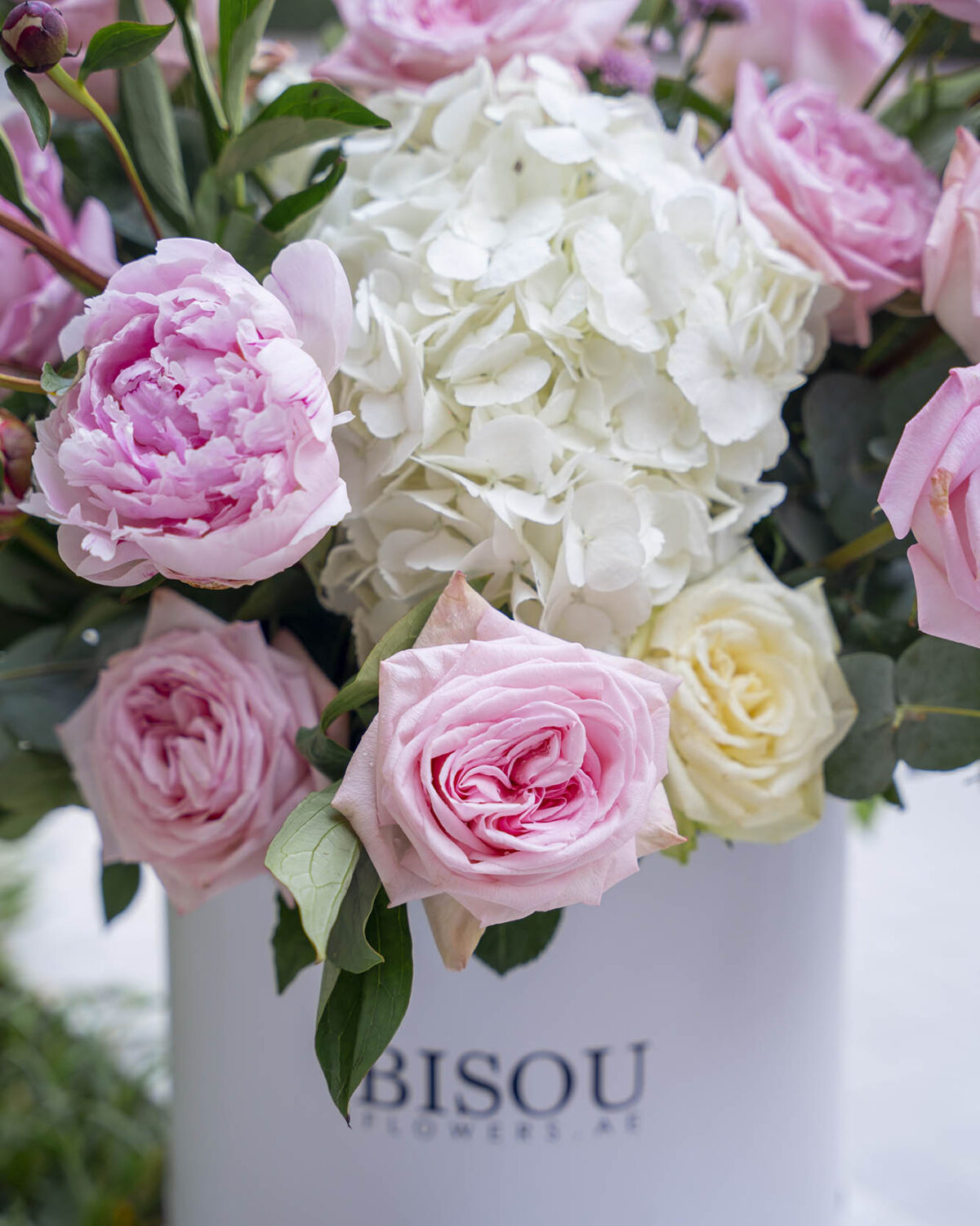 Platinum bouquet containing various pink flowers