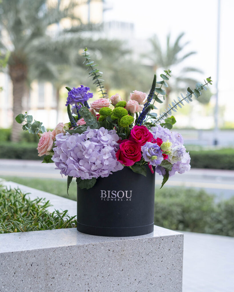 Mona flower bouquet arranged in a drum shaped box