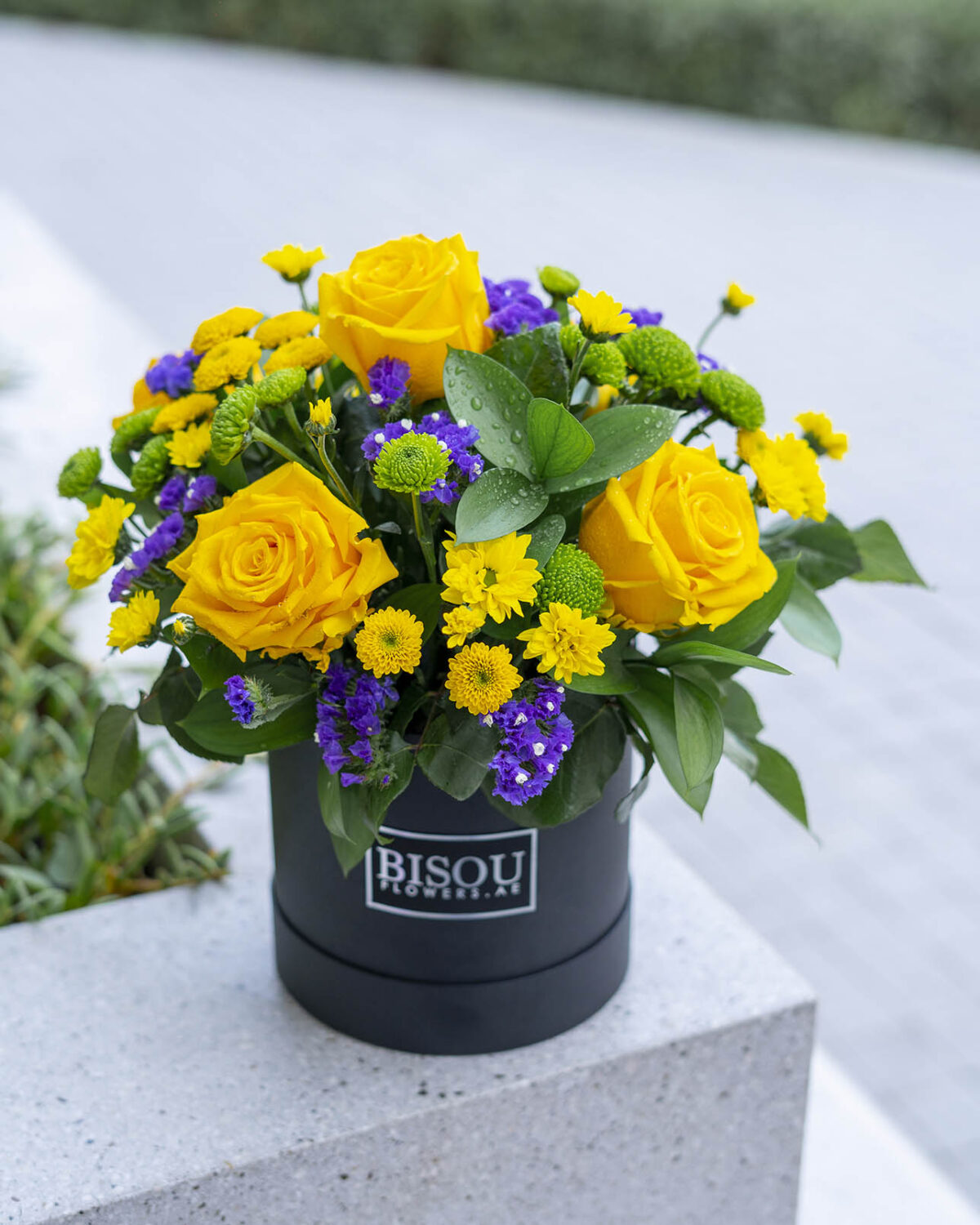 sunny flower bouquet arranged in a drum box