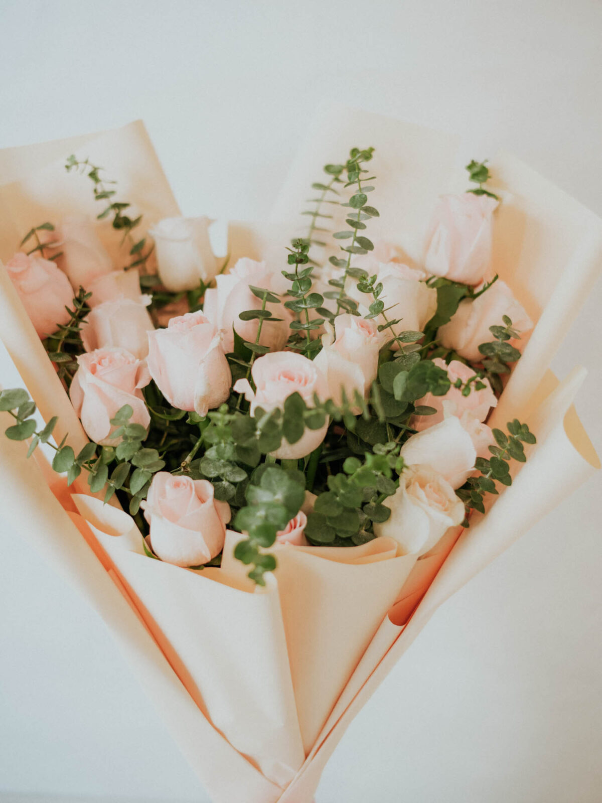 Bouquet of 25 stems of pink roses with fillers in a nice wrapping