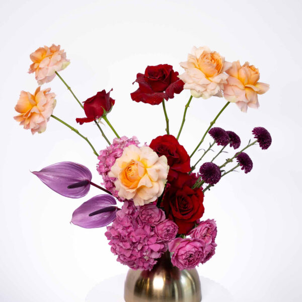 Ethereal beauty flowers arranged in a brass vase
