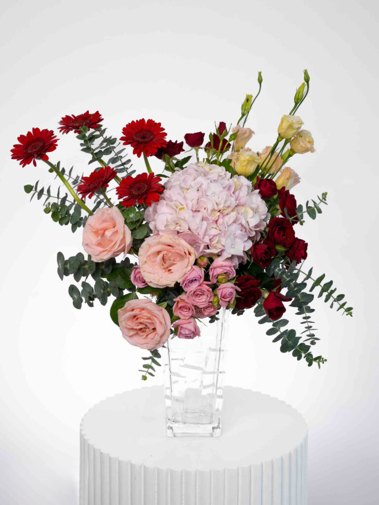 Joyful Moments flowers arranged in a glass vase