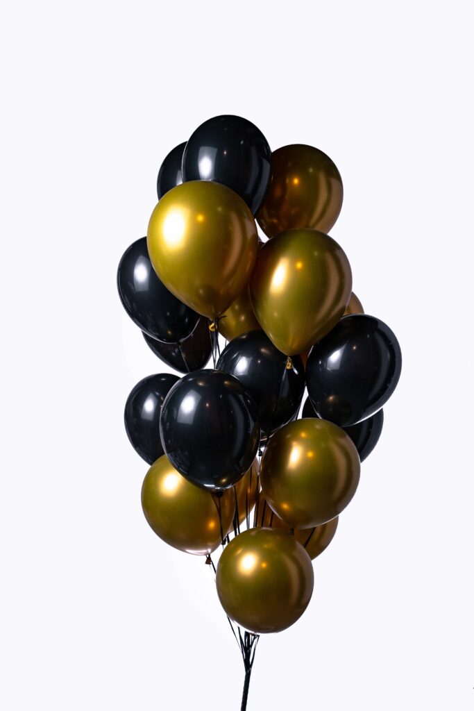 10 gold and black helium balloons